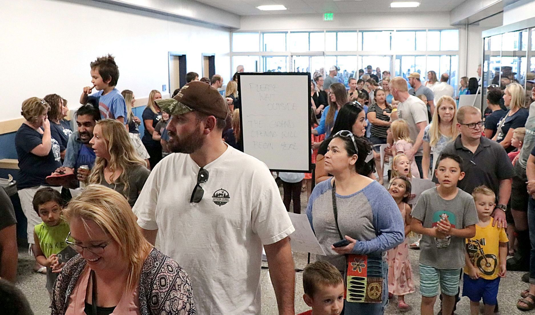 Children and parents enter Liberty Peak